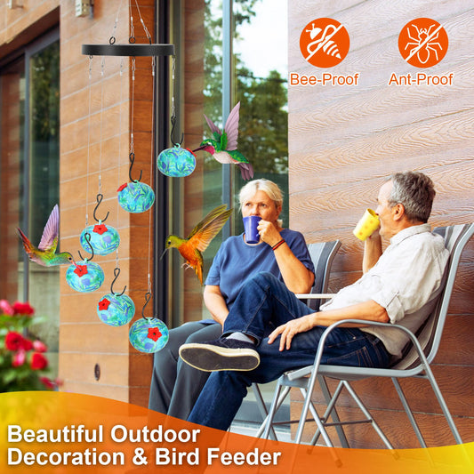 Hummingbird feeder wind chime close-up – blue feeder balls with red silicone flower caps