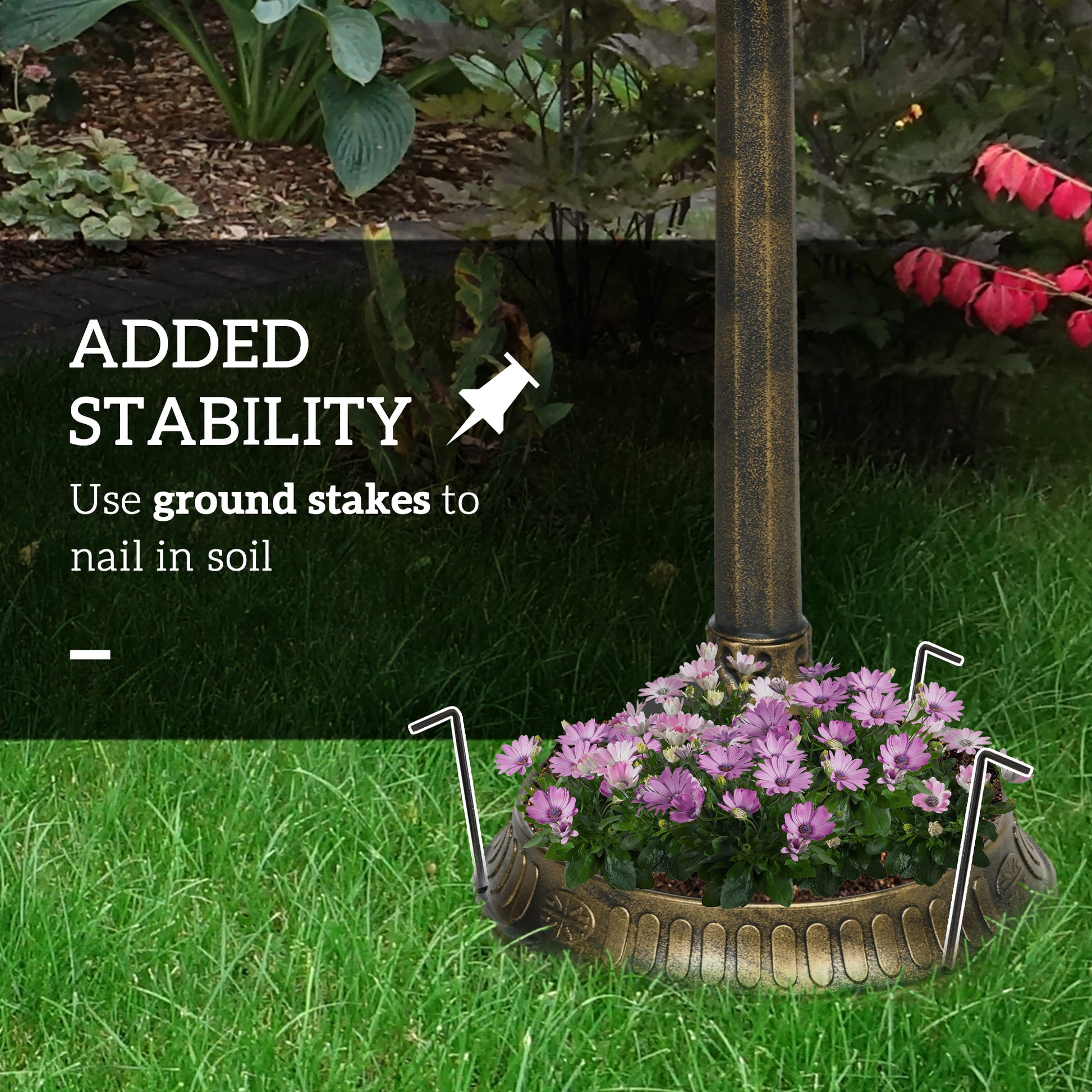 Close-up of bird statues on top of antique bronze bird feeder bowl
