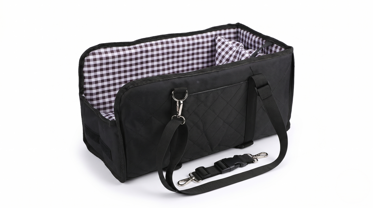 Black dog console car seat with plaid interior lining and adjustable shoulder strap on white background