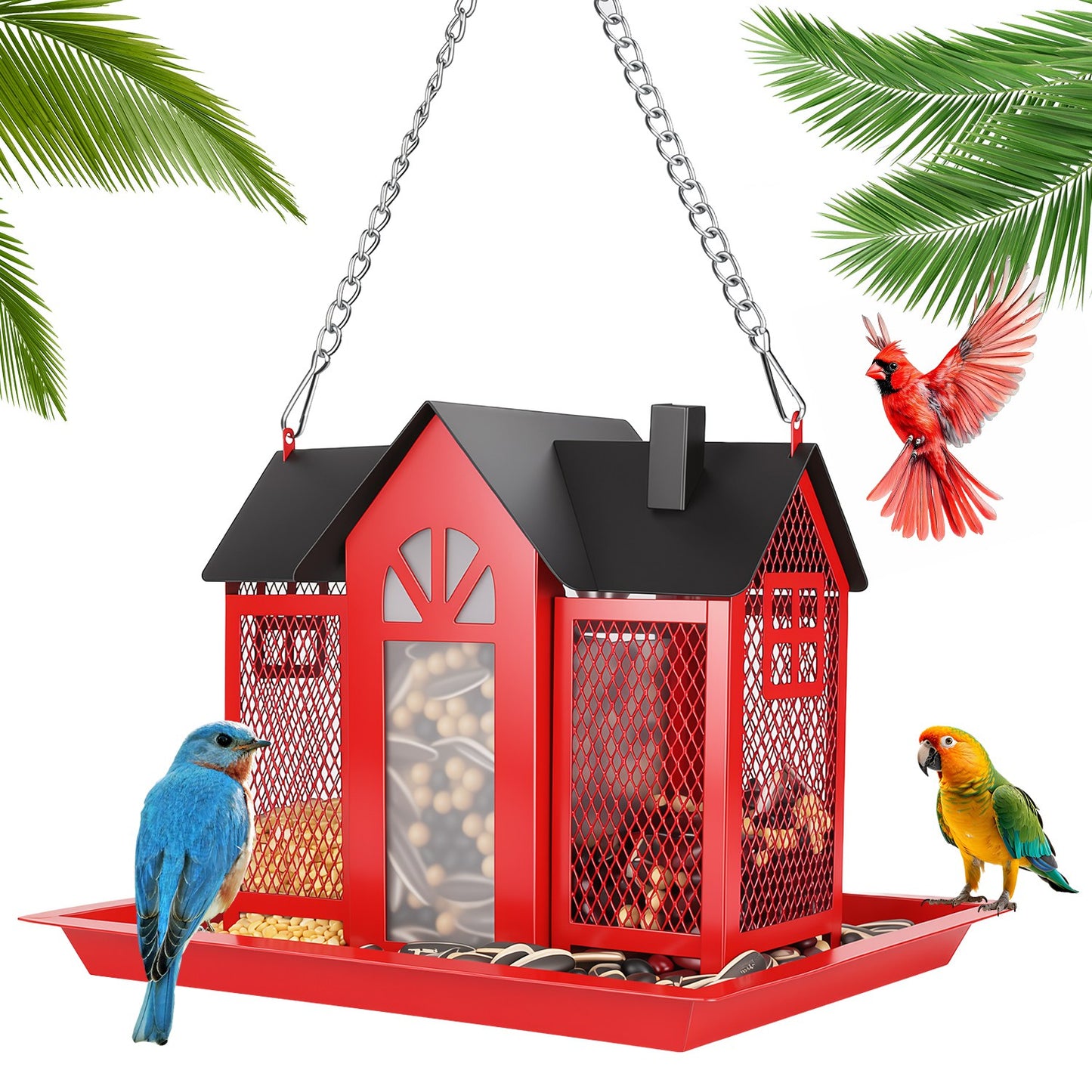 Red classic barn metal bird feeder hanging from tree branch in garden